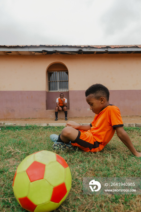 Child taking a break off playing