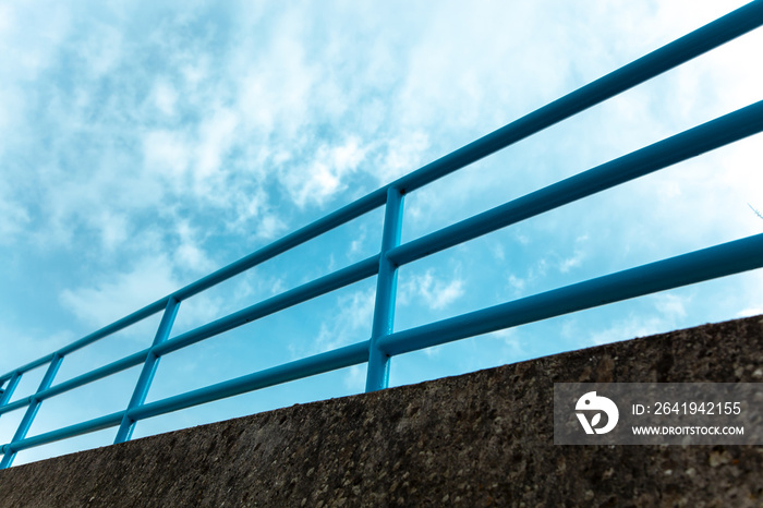 Blue steel railing abstract pattern of the bridge railing. metal construction, steel railing on the 