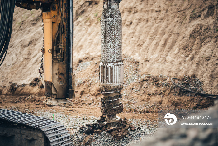 Details of industrial rotary drill machinery boring holes for viaduct on highway construction site