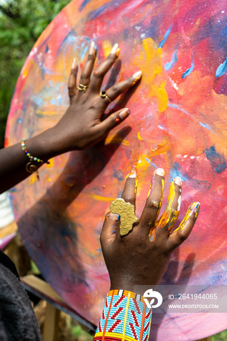 artist painting using her hands