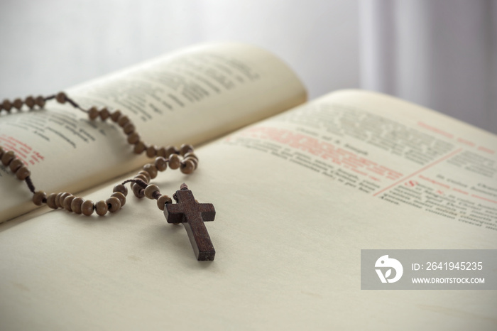 Catholic rosary beads and bible