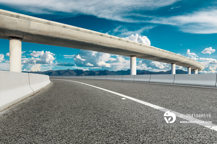 New asphalt road and mountain with sky cloud natural scenery.