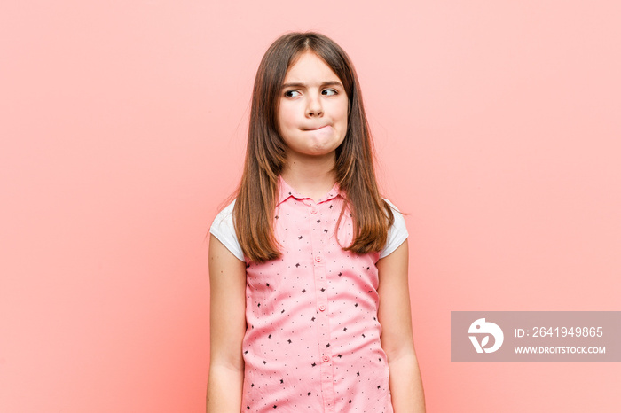 Cute little girl confused, feels doubtful and unsure.