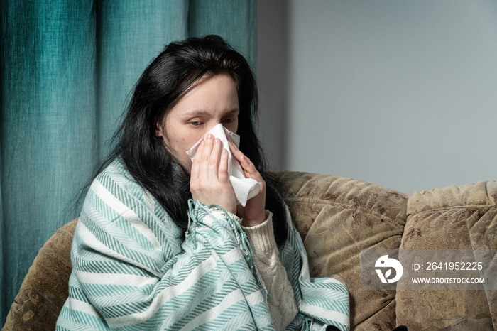 Sick young woman in bed at home having flu