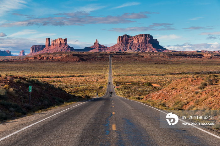 Open road of Route 163 with the Monument Valley on its background. The location made famous by the m