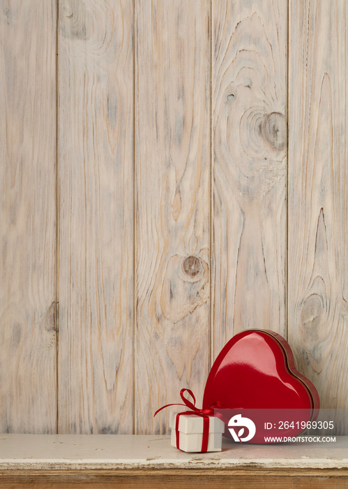 Valentines day concept. Red metal box in heart shape on a light