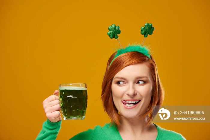 Playful leprechaun with green beer