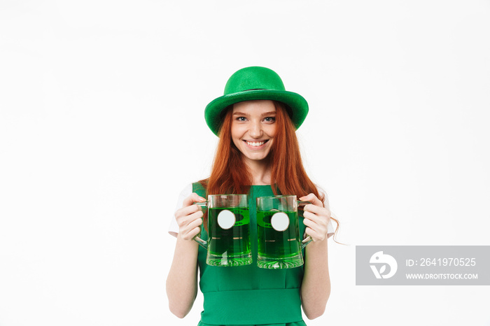 Happy young redheaded girl wearing green hat