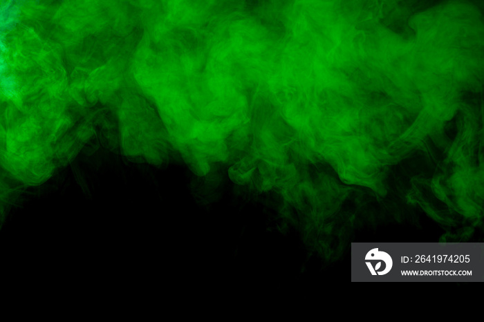 Green cloud of smoke on black background