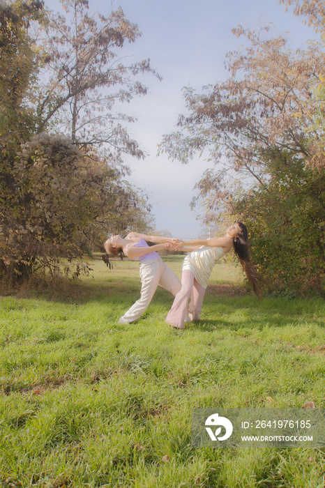 women in nature dancing