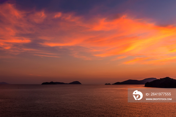 A view of the vibrant stage of the sunset offshore from the island of Bali, Asia