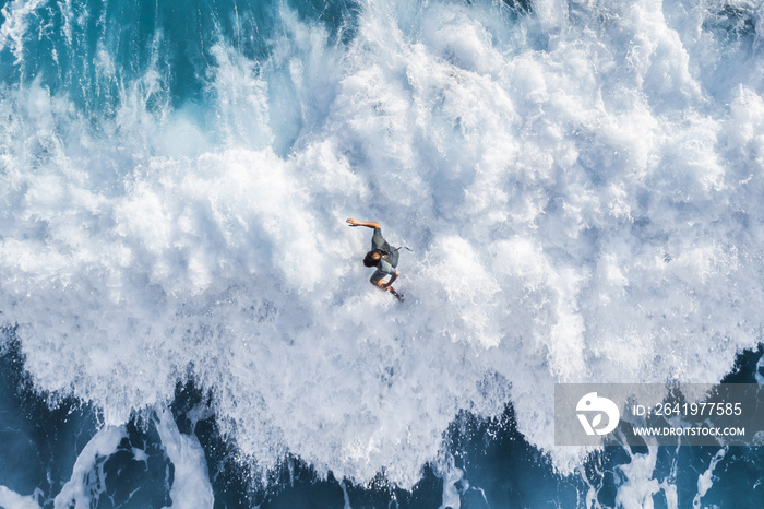 Surfer on the crest of the wave, top view