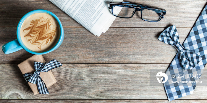 Fathers Day Concept With Coffee Mug Reading Glasses Tie Bow Newspaper And Gift