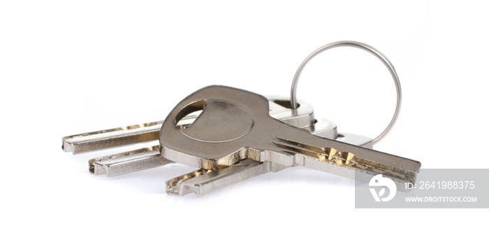 Four house keys on a key ring isolated on a white background.