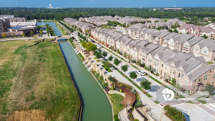 Top view new development riverside residential and commercial neighborhood with vacant land in Texas