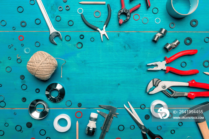 Plumbing toolkit on work desk top view flat lay