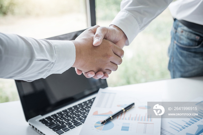 Finishing up a meeting, Business handshake after discussing good deal of Trading to sign agreement a