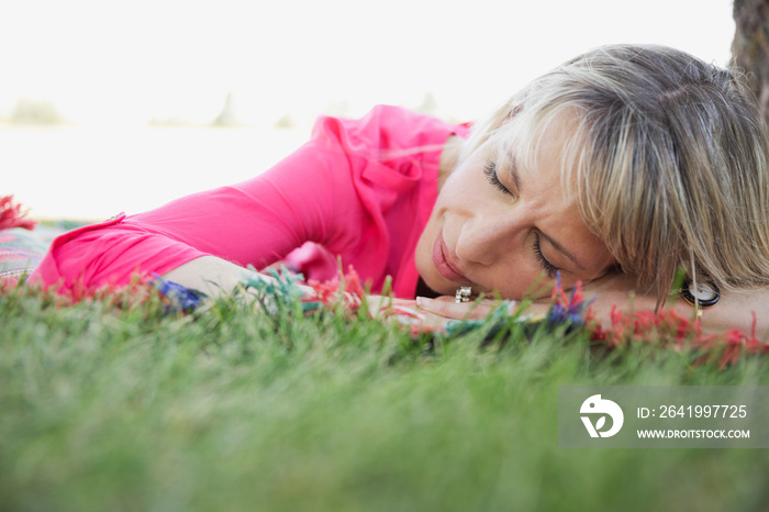 Middle-aged woman resting outdoors