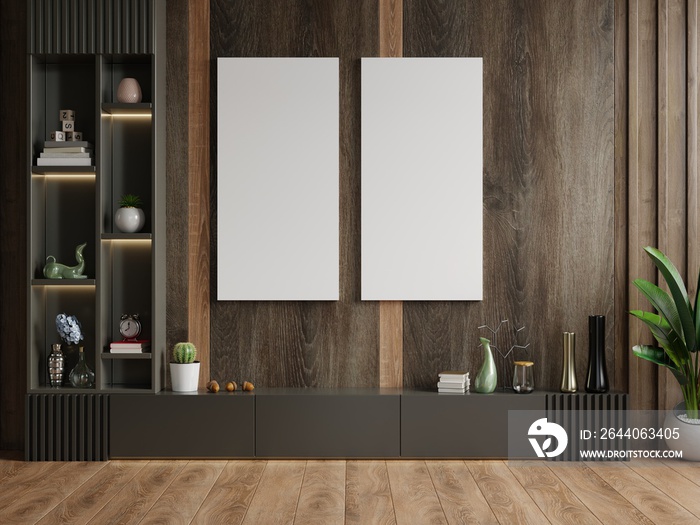 Poster mockup with vertical frames on empty dark wooden wall in living room interior with cabinet.