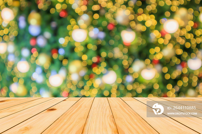 Empty wood table top with Abstract blur Christmas tree with decoration bokeh light background for pr