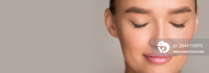 Beautiful girl with natural makeup and closed eyes