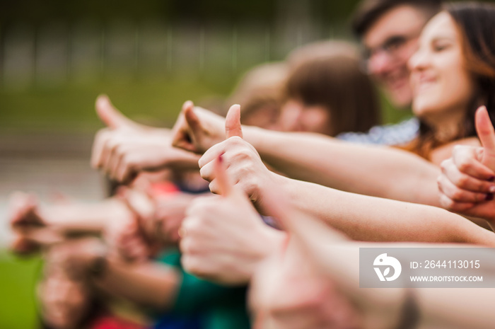 Hands of young people in the nature