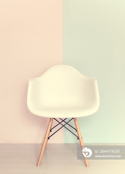 White chair on pastel background