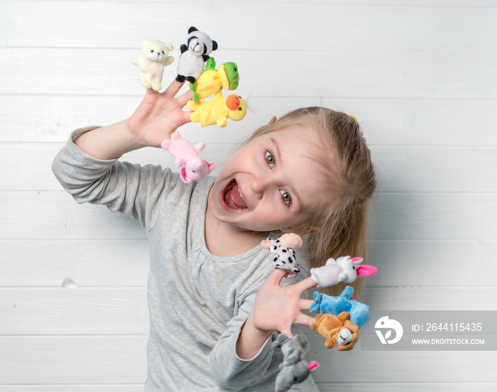 girl with doll puppets on her hands