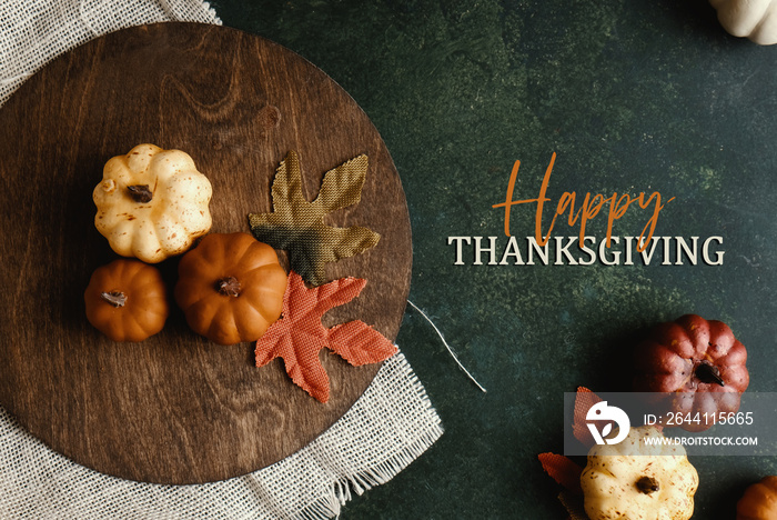 Happy Thanksgiving flat lay background with fall season decoration.  Top view of pumpkins and leaves