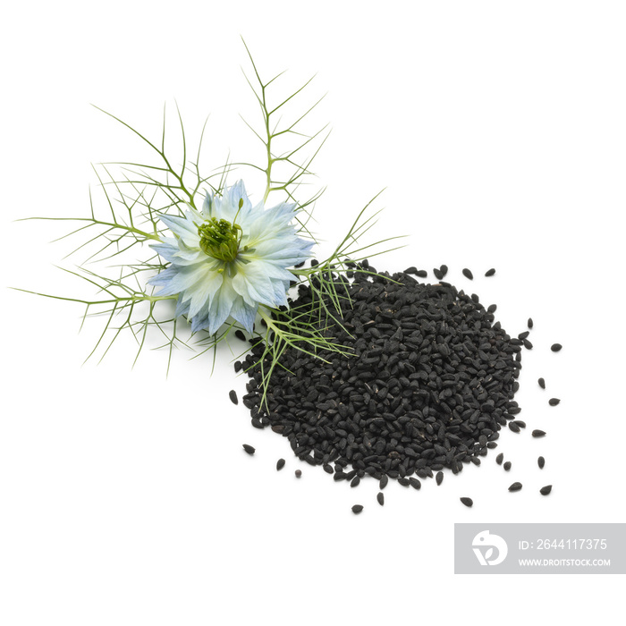 Heap of black nigella seeds and flower