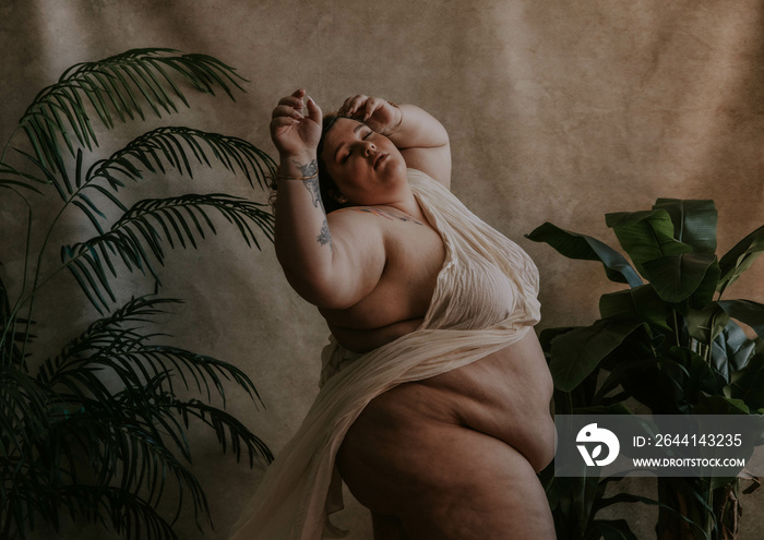 fat white woman with fabric stretching belly exposed