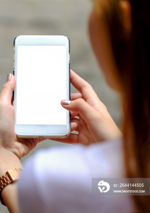 Smart phone white display in hand girl.