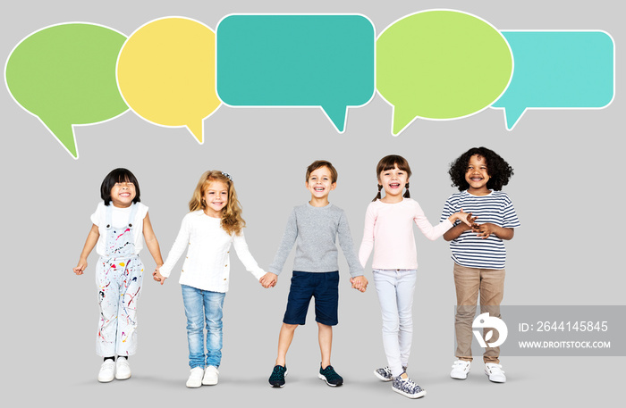 Happy diverse kids with speech bubbles