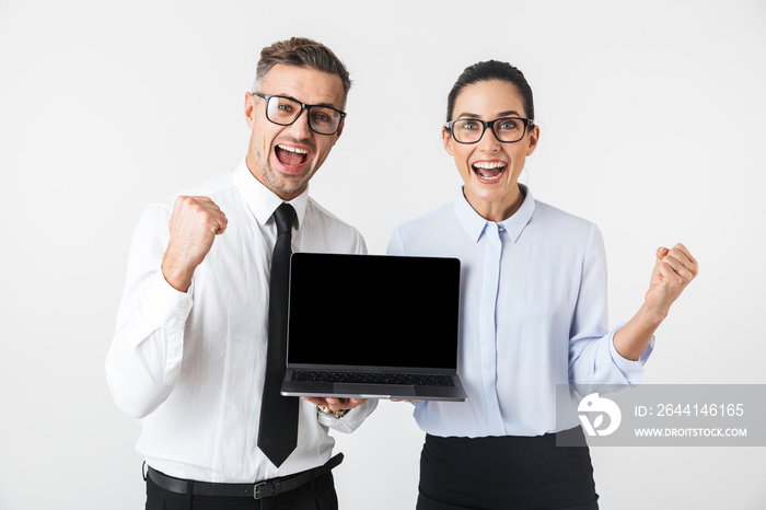 Business colleagues couple isolated over white wall background using laptop computer.