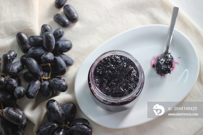 Home made Grape jam with three ingredients, seedless black grapes, sugar and lime juice.
