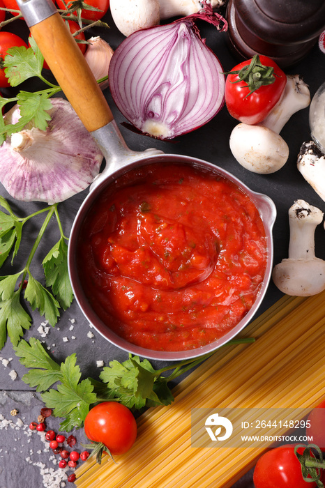 tomato sauce in pan with spices and ingredient