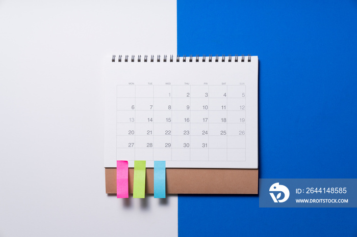 close up of calendar on the white and blue table background, planning for business meeting or travel