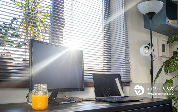 home office interior with desk space at sunset