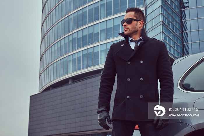 Portrait of a bodyguard in a stylish suit.