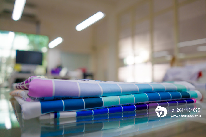 A blurred background photo of the inside of printing room. Color Palette Guide. Sample Colors Catalo