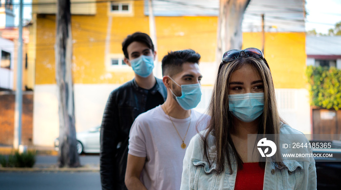 woman with mask waiting to enter an establishment. sanitary measures concept