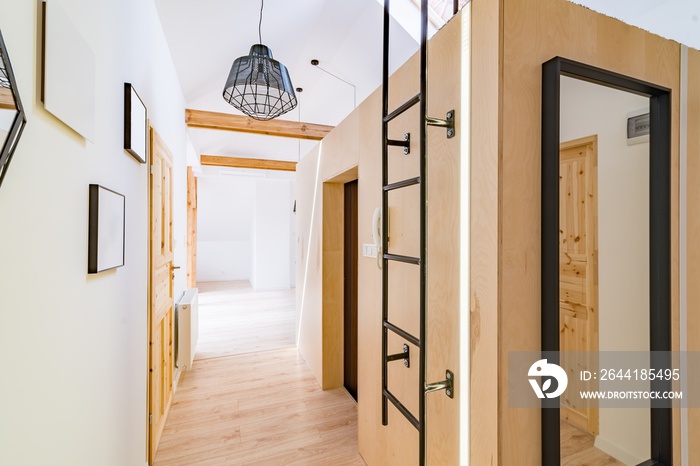 Apartment hall with wooden doors.