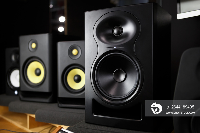 Buy new speakers. Professional studio monitors in music store. High fidelity speaker for hifi sound 