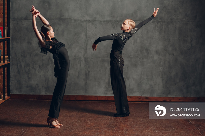 Young couple dancing ballroom dance Paso doble.