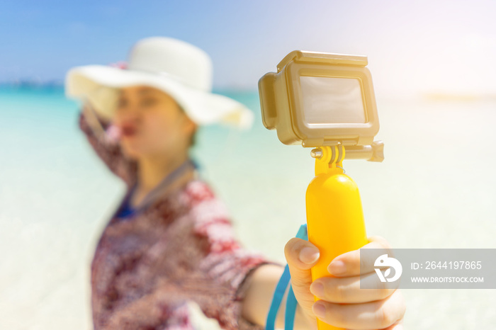 Traveler girl taking selfie on the beach in Phuket, Thailand.