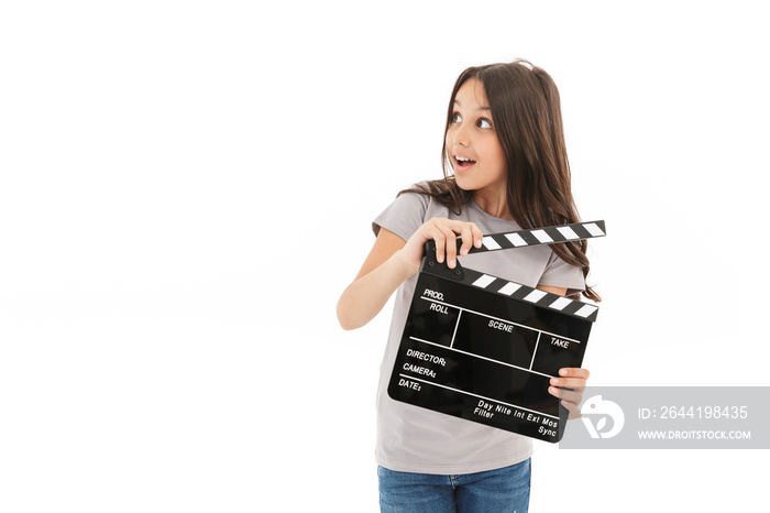 Cute girl holding film making clapperboard.