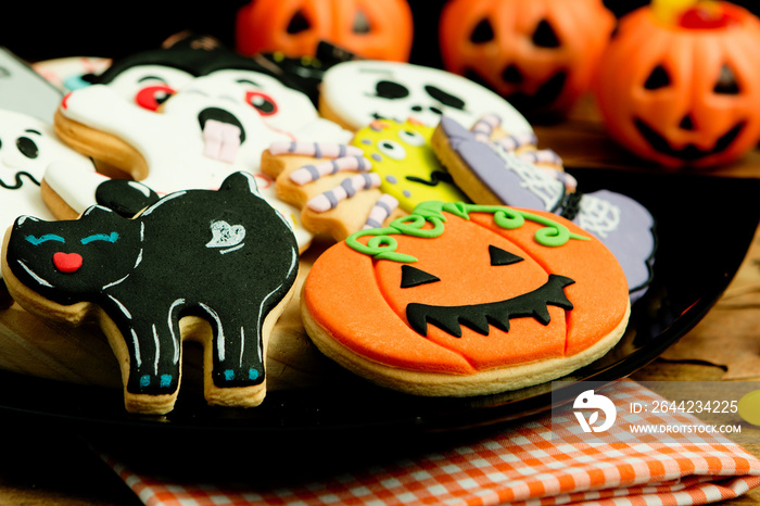 Creepy Halloween cookies and pumpkin baskets filled with candies