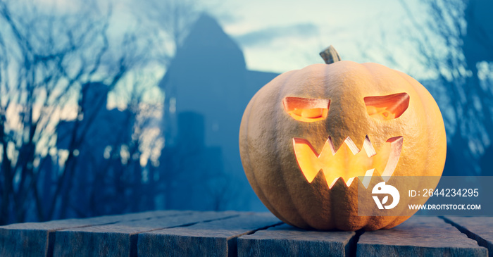 Halloween pumpkin glowing on gothic graveyard.