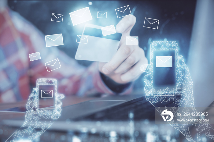 Double exposure of man hands holding a credit card and envelop fly drawing. E-mail and E-commerce pa