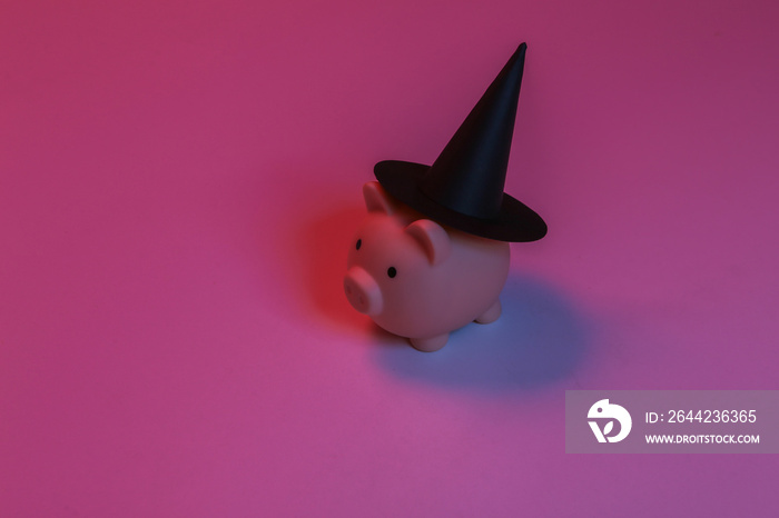 Piggy bank in a witchs hat. Red-blue gradient neon light. Halloween theme